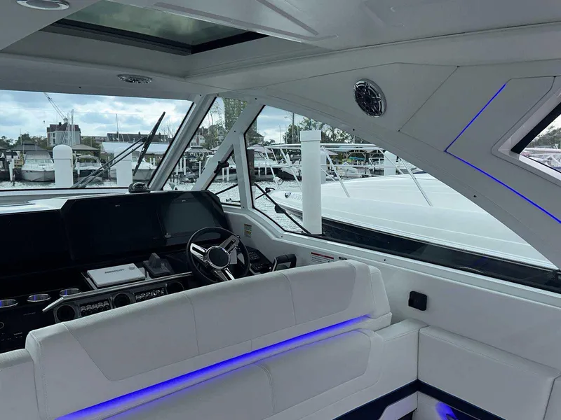 Slide: The Image of 2026 Formula 380 Super Sport Crossover OB boat interior with luxurious seating and modern design. - 32