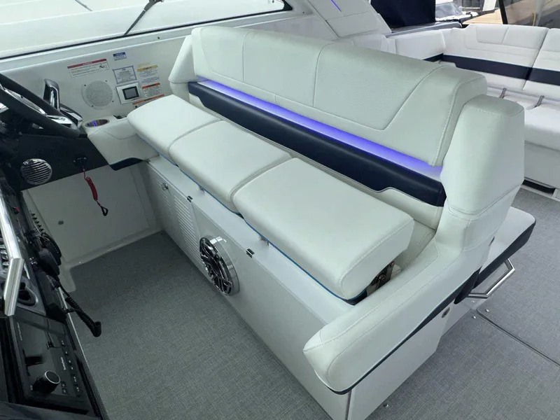 Slide: The Image of 2026 Formula 380 Super Sport Crossover OB boat seating with cup holders and sleek design. - 34