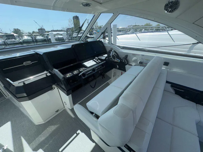 Slide: The Image of 2026 Formula 380 Super Sport Crossover OB interior seating with cup holders and sleek design. - 36