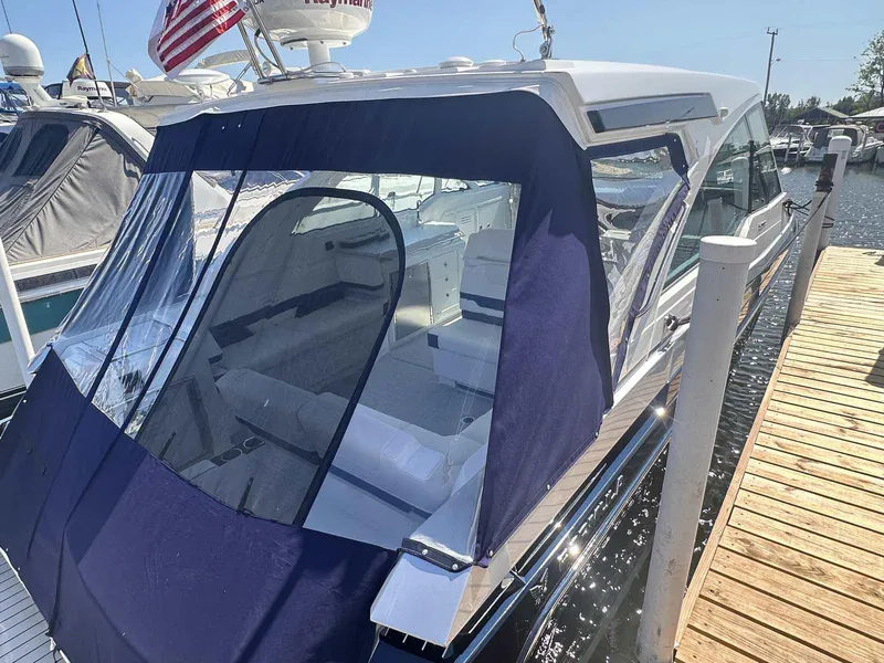 Slide: The Image of 2026 Formula 380 Super Sport Crossover OB boat in a showroom setting. - 5