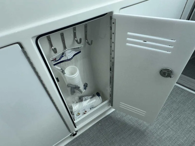 Slide: The Image of 2026 Formula 380 Super Sport Crossover OB storage compartments on sleek deck. - 50