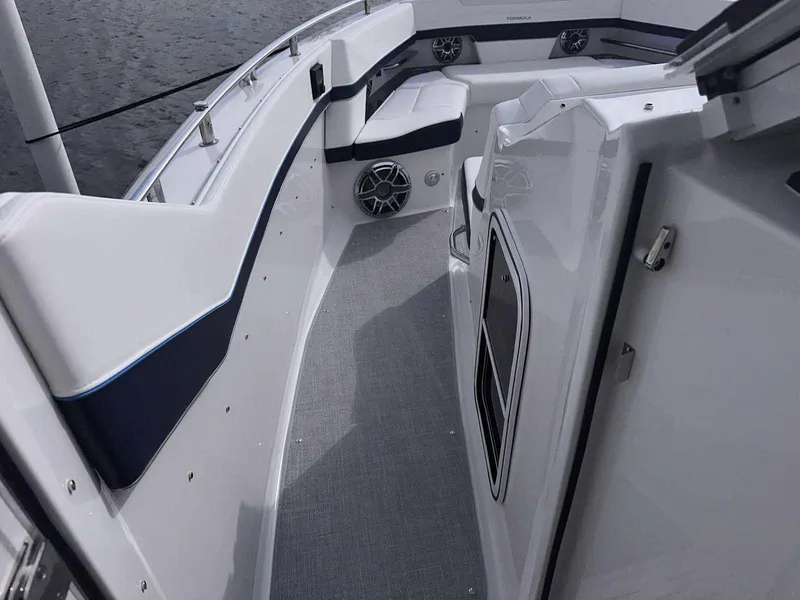 Slide: The Image of Storage compartment in 2026 Formula 380 Super Sport Crossover OB boat, containing coiled hoses. - 52