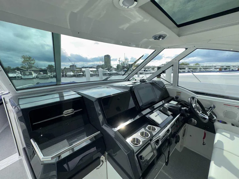Slide: The Image of Interior view of 2026 Formula 380 Super Sport Crossover OB boat, showcasing sleek design and lighting. - 61
