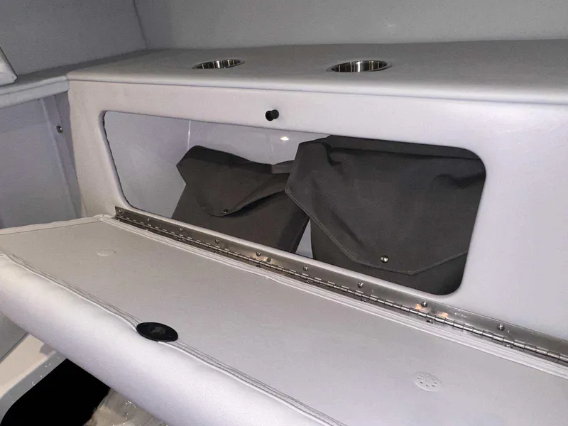 Slide: The Image of Storage compartment with fire extinguisher on 2026 Formula 380 Super Sport Crossover OB boat. - 67