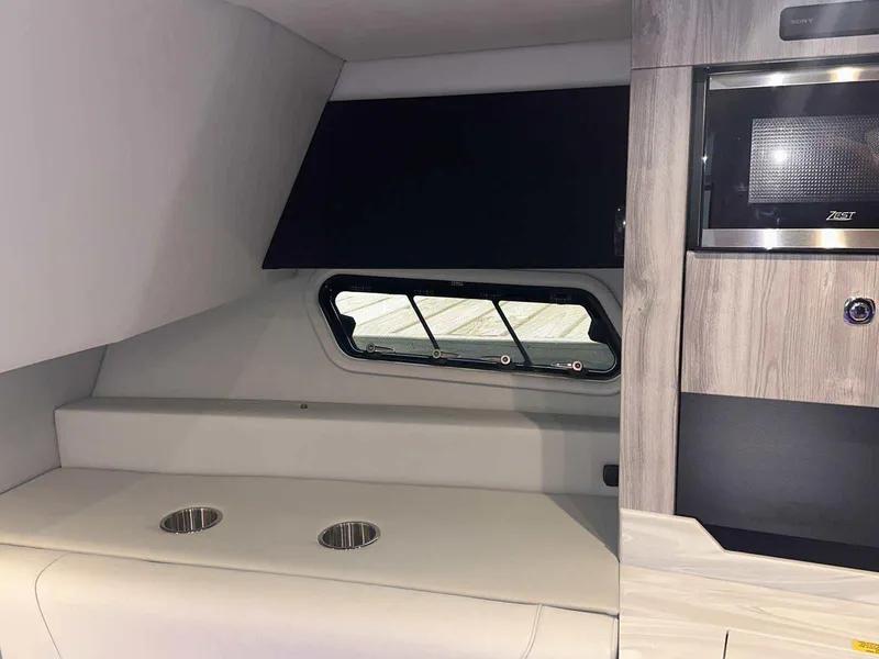 Slide: The Image of 2026 Formula 380 Super Sport Crossover OB interior with sleek seating and modern amenities. - 69