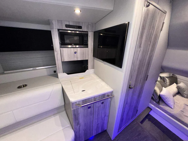 Slide: The Image of 2026 Formula 380 Super Sport Crossover OB interior with sleek seating and cup holders. - 70