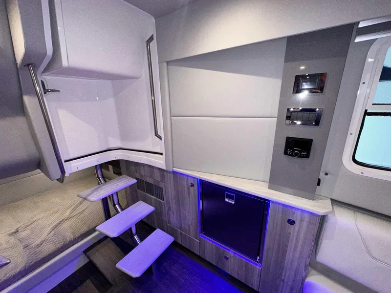 Slide: The Image of 2026 Formula 380 Super Sport Crossover OB boat interior with sleek white seating. - 76