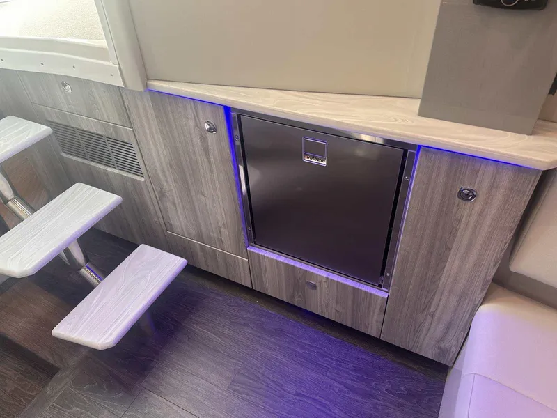 Slide: The Image of 2026 Formula 380 Super Sport Crossover OB interior seating, featuring sleek white upholstery. - 79