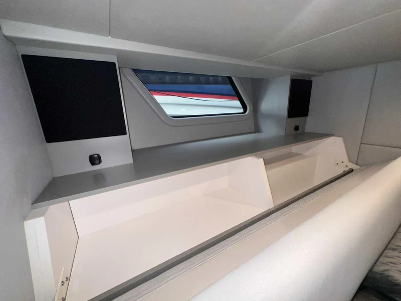 Slide: The Image of Interior view of 2026 Formula 380 Super Sport Crossover OB boat seating and storage. - 83