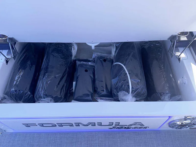 Slide: The Image of 2026 Formula 380 Super Sport Crossover OB boat engines and propellers in a workshop. - 9