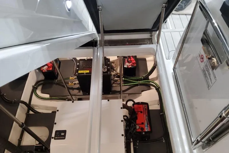 Slide: The Image of Engine compartment of 2026 Formula 380 Super Sport Crossover OB with visible batteries and wiring. - 90