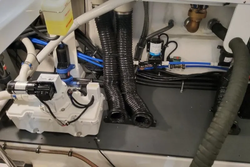 Slide: The Image of Engine compartment of 2026 Formula 380 Super Sport Crossover OB with hoses and components. - 92