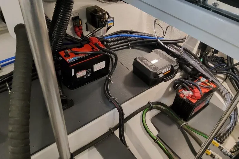 Slide: The Image of Engine compartment of 2026 Formula 380 Super Sport Crossover OB with batteries and wiring. - 93