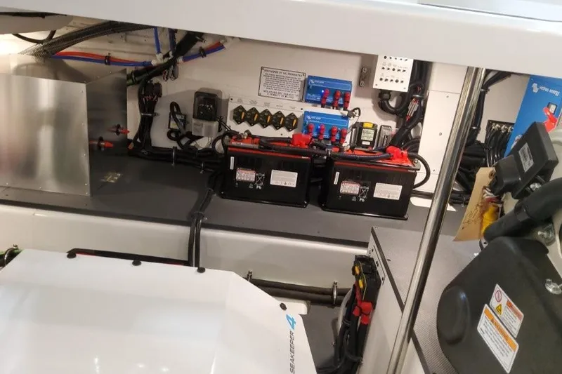 Slide: The Image of Engine compartment of 2026 Formula 380 Super Sport Crossover OB with batteries and wiring. - 97