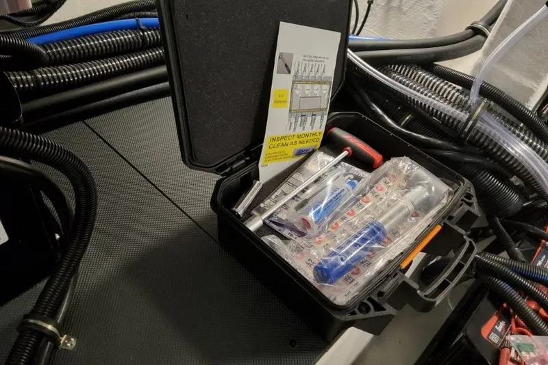 Slide: The Image of Tool kit on Formula 380 Super Sport Crossover OB, 2026 model, with maintenance instructions. - 98