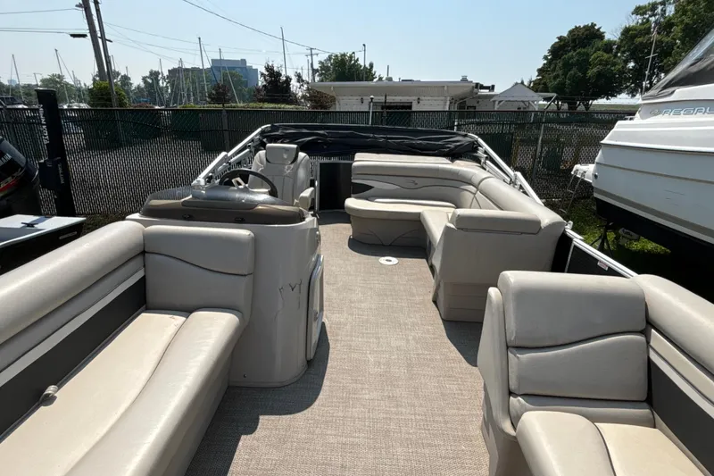 Slide: The Image of 2019 Bennington 21 SLX pontoon boat with spacious seating and modern design. - 2