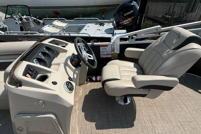 Slide: The Image of 2019 Bennington 21 SLX boat interior with steering console and captain's chair. - 6