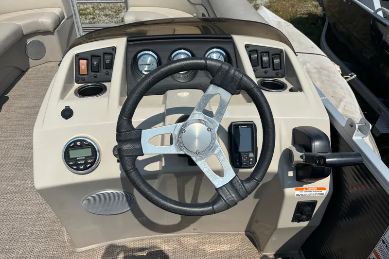 Slide: The Image of Steering console of a 2019 Bennington 21 SLX pontoon boat with gauges and controls. - 7