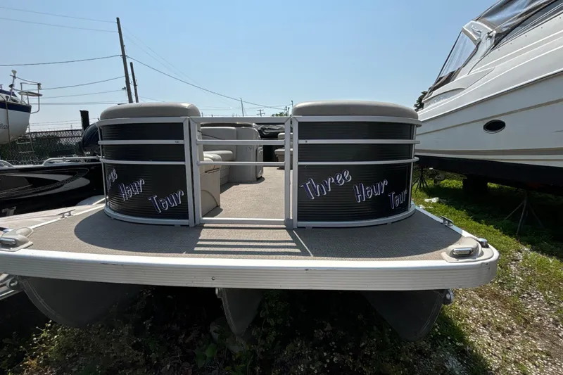 Slide: The Image of 2019 Bennington 21 SLX pontoon boat with "Three Hour Tour" text on the front. - 8