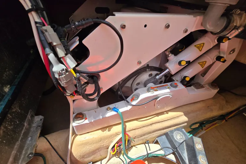 Slide: The Image of Engine compartment of a 2001 Nordic Tug 32, showcasing mechanical components and wiring. - 33