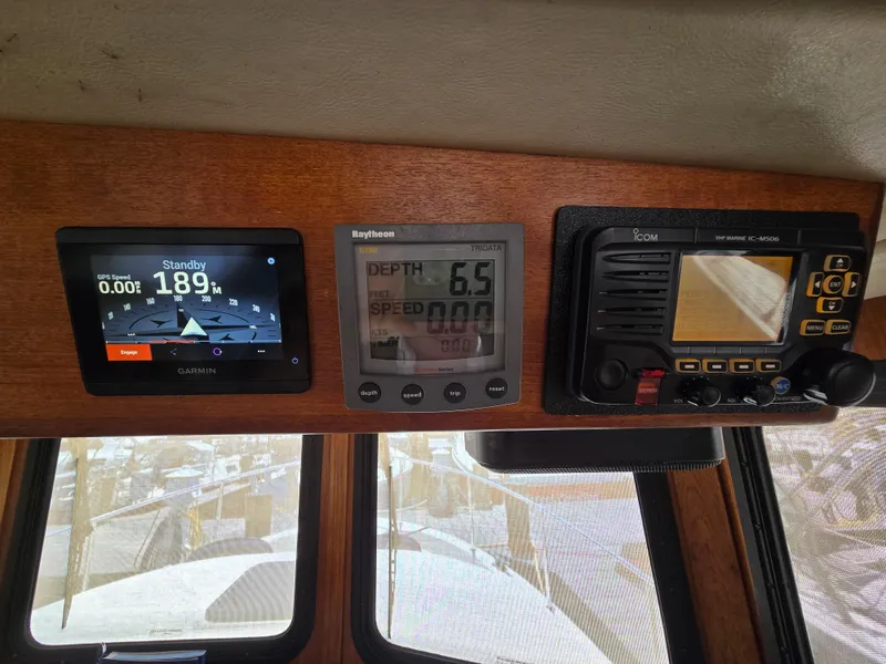 Slide: The Image of Navigation instruments on a 2001 Nordic Tug 32 boat dashboard. - 6