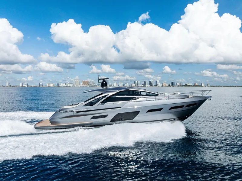 The Image of Luxury Pershing 7X yacht cruising on open water, city skyline in background, 2025 model. - 0