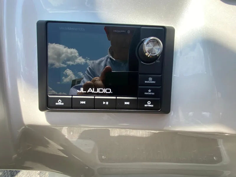 Slide: The Image of JL Audio system on 2020 Manitou 25 Legacy SHP DL boat dashboard. - 23
