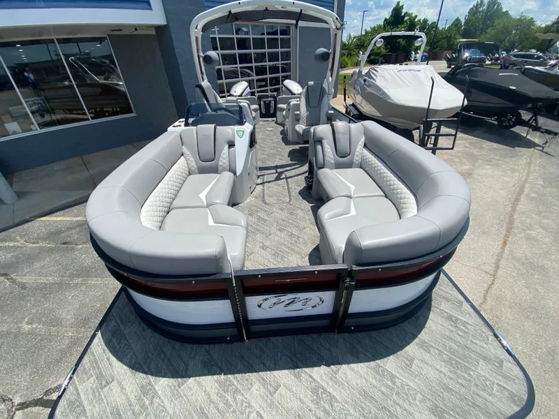 Slide: The Image of 2020 Manitou 25 Legacy SHP DL pontoon boat with luxurious seating and modern design. - 8
