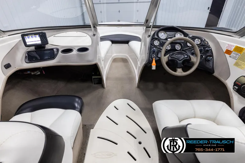 Slide: The Image of Interior of 2002 Tahoe Q3 I/O Mechanical Special boat with steering wheel and dashboard. - 13