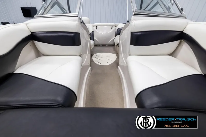 Slide: The Image of Interior of 2002 Tahoe Q3 I/O Mechanical Special boat with black and white seating. - 15