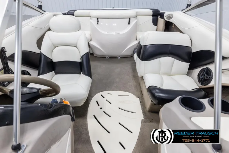 Slide: The Image of Interior of 2002 Tahoe Q3 I/O Mechanical Special boat with white and black seating. - 16