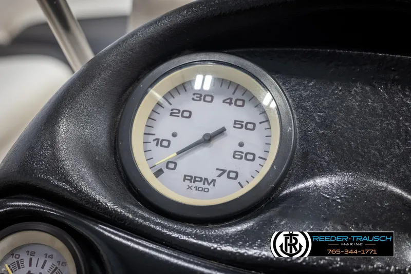 Slide: The Image of Close-up of a 2002 Tahoe Q3 I/O tachometer showing RPM gauge. - 27
