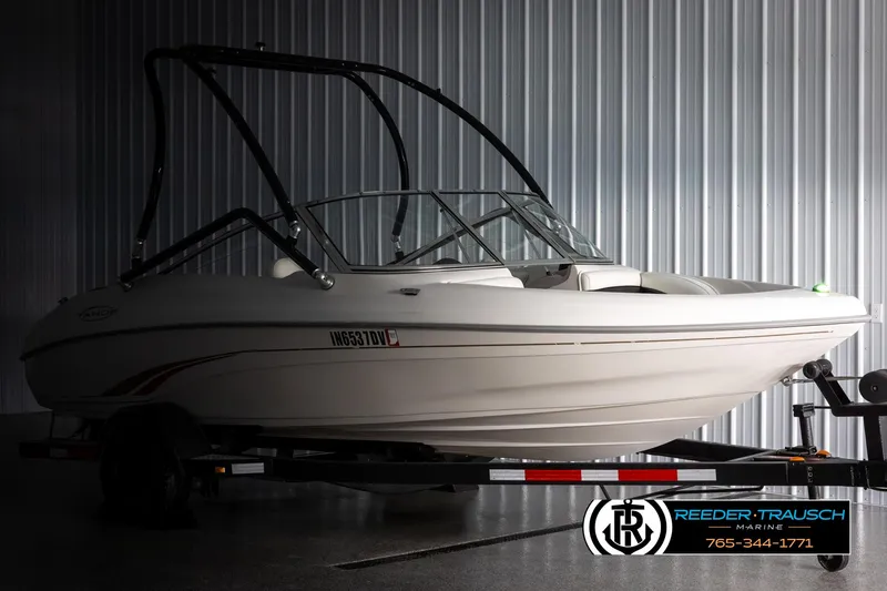 Slide: The Image of 2002 Tahoe Q3 I/O Mechanical Special boat on trailer in indoor storage. - 3