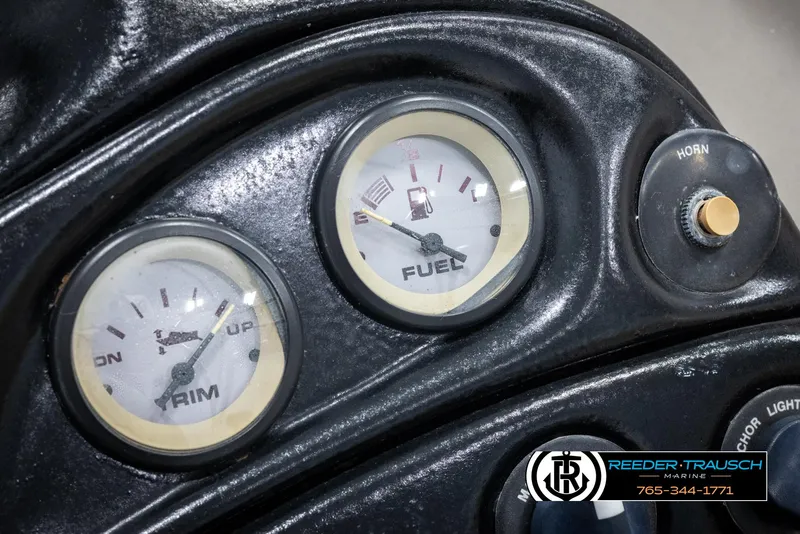 Slide: The Image of Close-up of 2002 Tahoe Q3 I/O dashboard with fuel and trim gauges. - 30