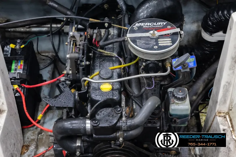 Slide: The Image of 2002 Tahoe Q3 I/O mechanical engine with Mercury MerCruiser components and visible wiring. - 40