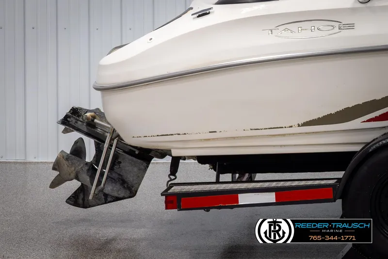 Slide: The Image of 2002 Tahoe Q3 I/O Mechanical Special boat on trailer, rear view with propeller. - 42