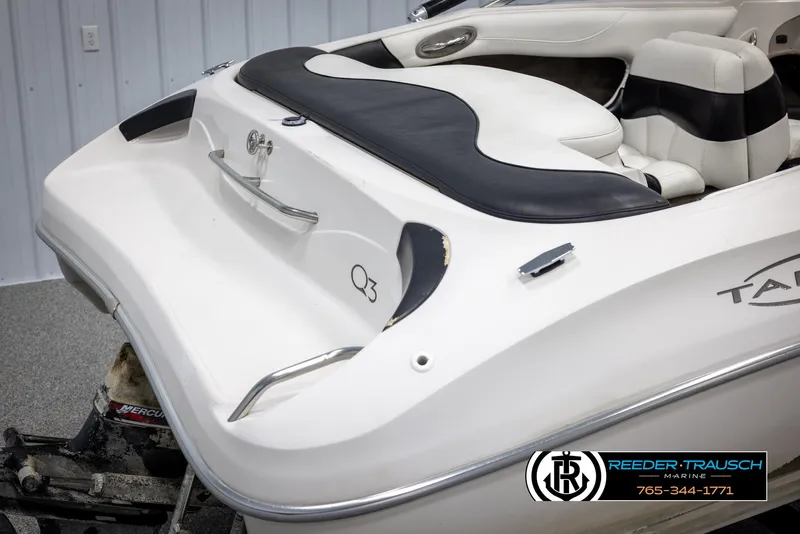 Slide: The Image of 2002 Tahoe Q3 I/O Mechanical Special boat, white and black interior, Reeder-Trausch Marine logo. - 47