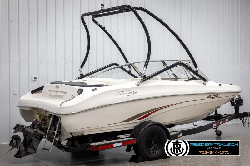 Slide: The Image of 2002 Tahoe Q3 I/O Mechanical Special boat on trailer in indoor storage. - 5