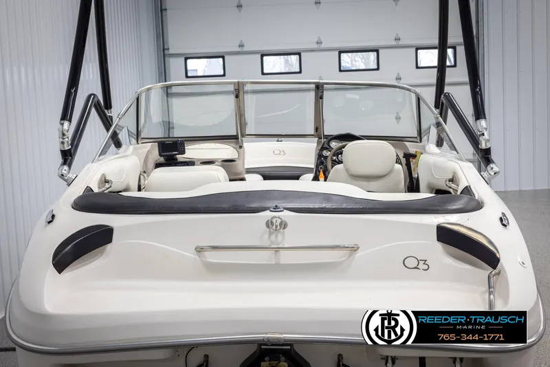 Slide: The Image of 2002 Tahoe Q3 I/O Mechanical Special boat interior in a garage setting. - 6