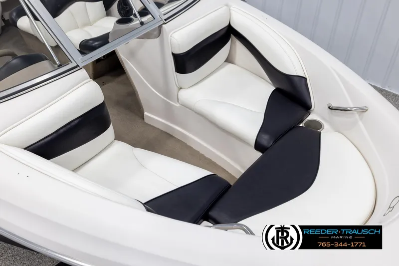 Slide: The Image of 2002 Tahoe Q3 I/O Mechanical Special boat interior with white and black seating. - 8