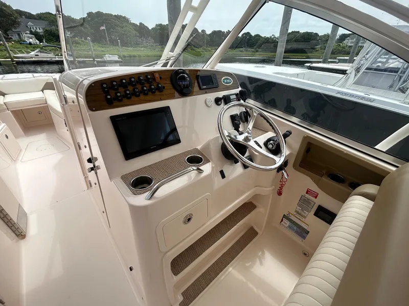 Slide: The Image of 2013 Grady-White Freedom 335 boat bathroom with sink, toilet, and wooden flooring. - 15