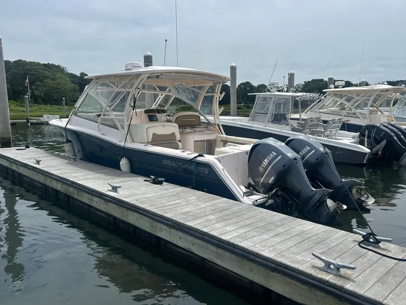 Slide: The Image of 2013 Grady-White Freedom 335 boat with Yamaha engines docked in marina. - 3
