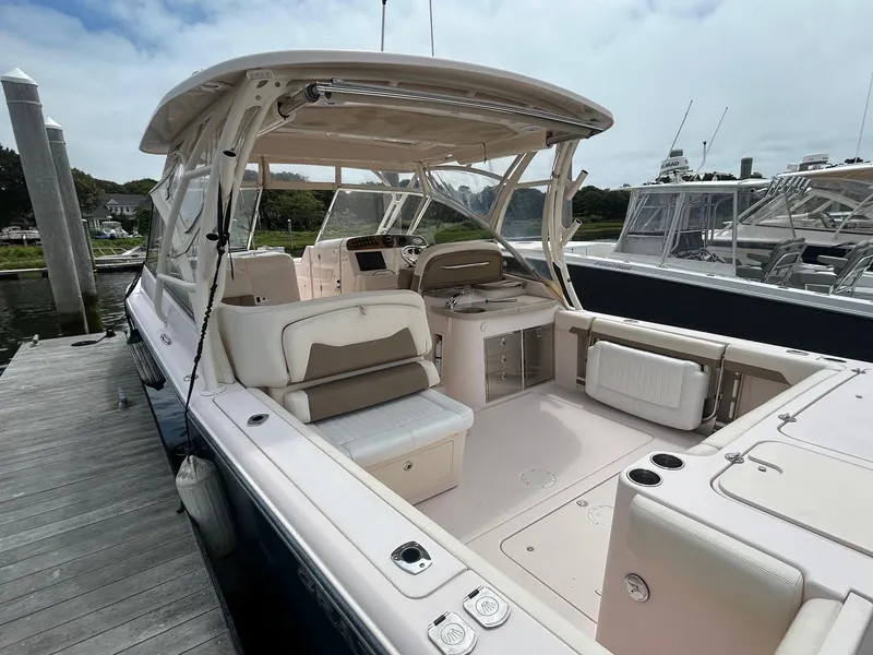 Slide: The Image of 2013 Grady-White Freedom 335 boat docked with twin Yamaha engines. - 5