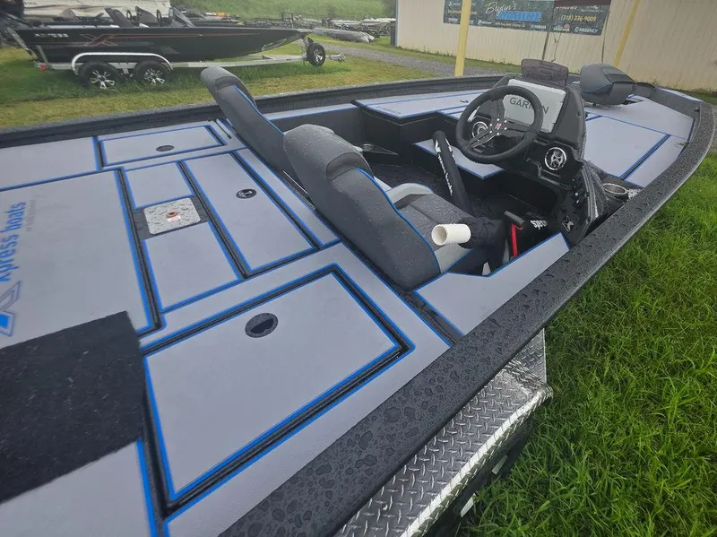 Slide: The Image of 2026 Xpress H20 Bass boat with Yamaha engine on trailer. - 12