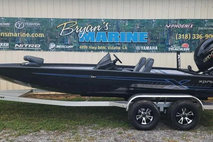 Slide: The Image of 2026 Xpress H20 Bass boat on trailer at Bryan's Marine dealership. - 19