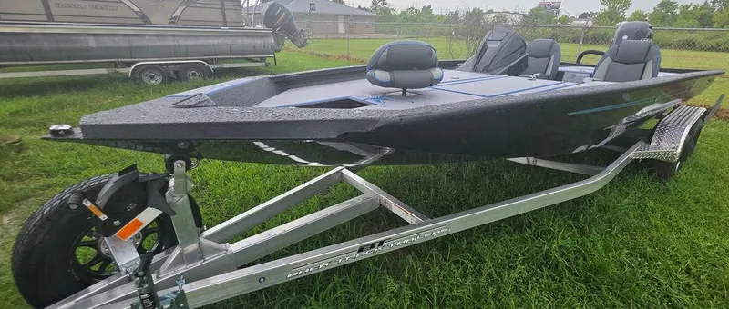 Slide: The Image of 2026 Xpress H20 Bass boat on trailer at Bryan's Marine dealership. - 2