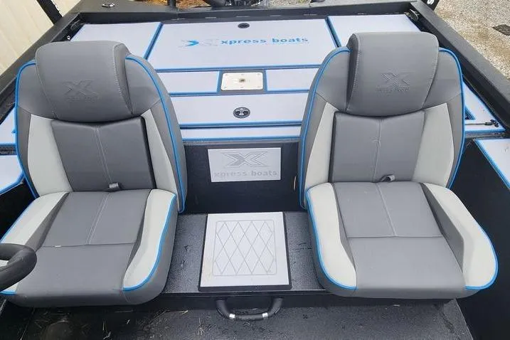 Slide: The Image of 2026 Xpress H20 Bass boat interior with two gray and blue seats. - 27