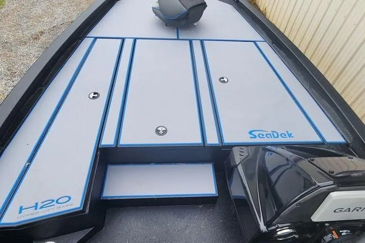 Slide: The Image of 2026 Xpress H20 Bass boat deck with SeaDek flooring and Garmin equipment. - 28
