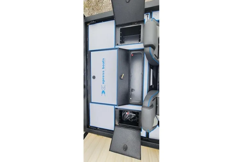 Slide: The Image of 2026 Xpress H20 Bass boat interior with storage compartments open. - 29