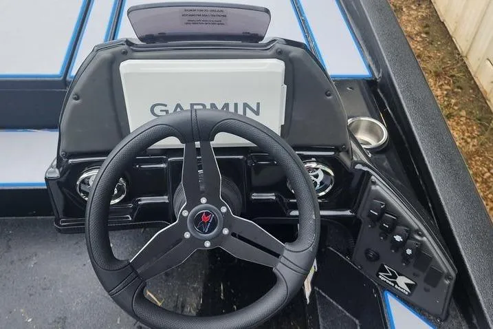 Slide: The Image of Steering console of 2026 Xpress H20 Bass boat with Garmin navigation system. - 31